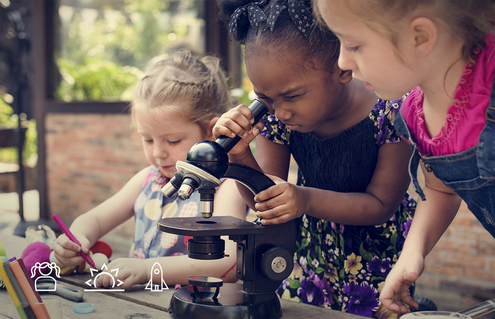 Kids learning about science and using a Microscope